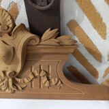 Old sandblasted wooden pediment