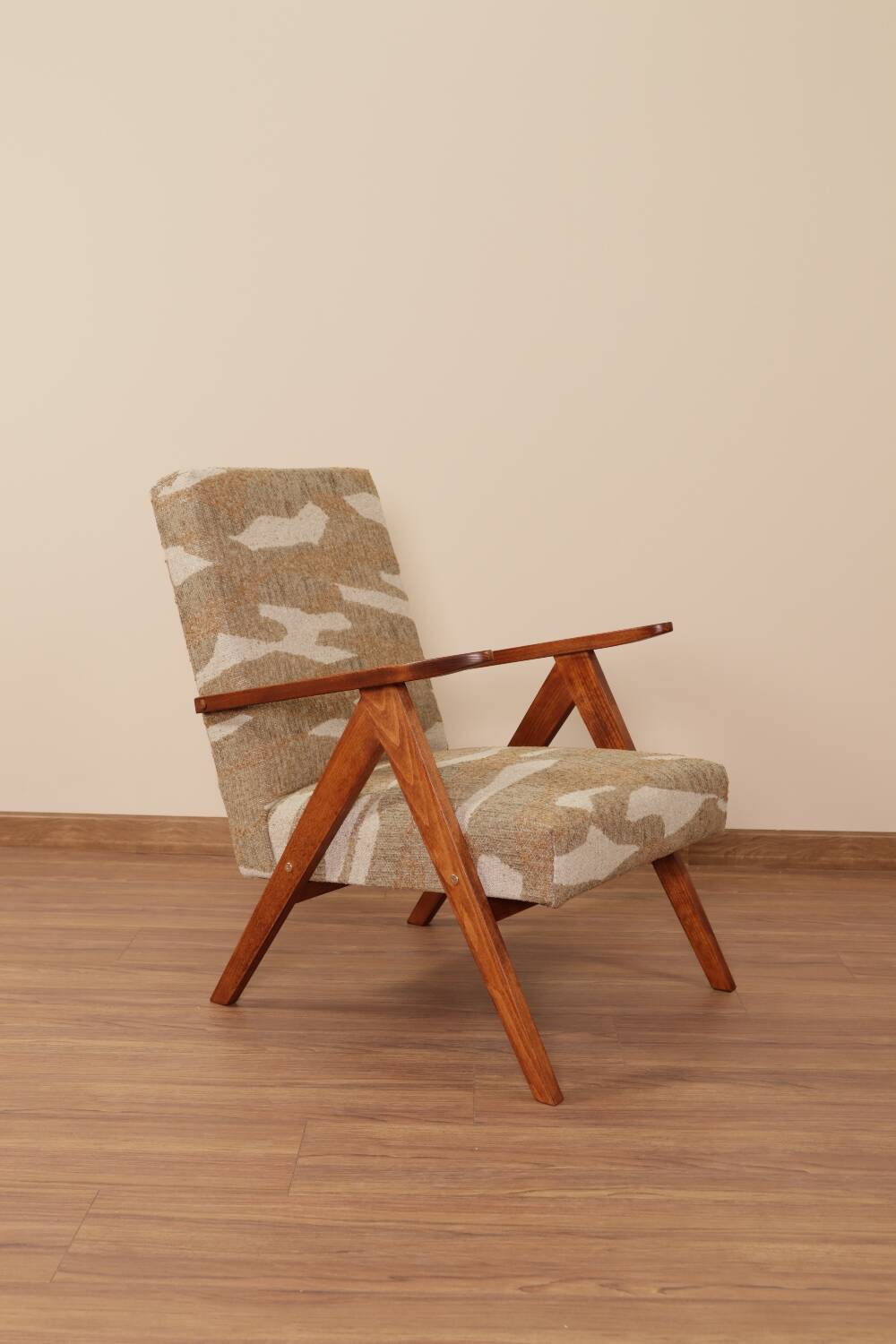 Pair of vintage lounge chairs in brown jacquard fabric and wood.