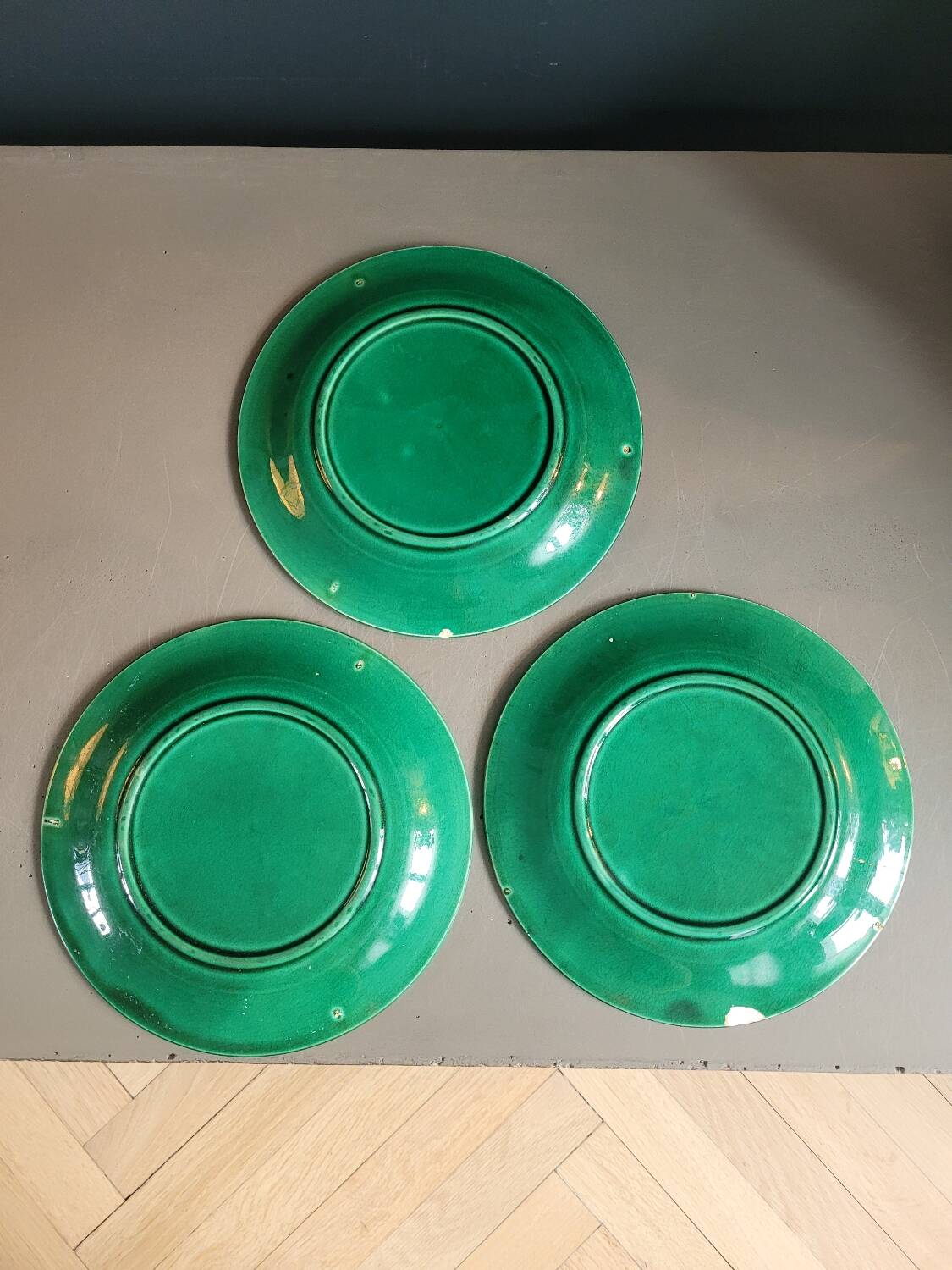 Three green slip plates