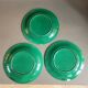 Three green slip plates