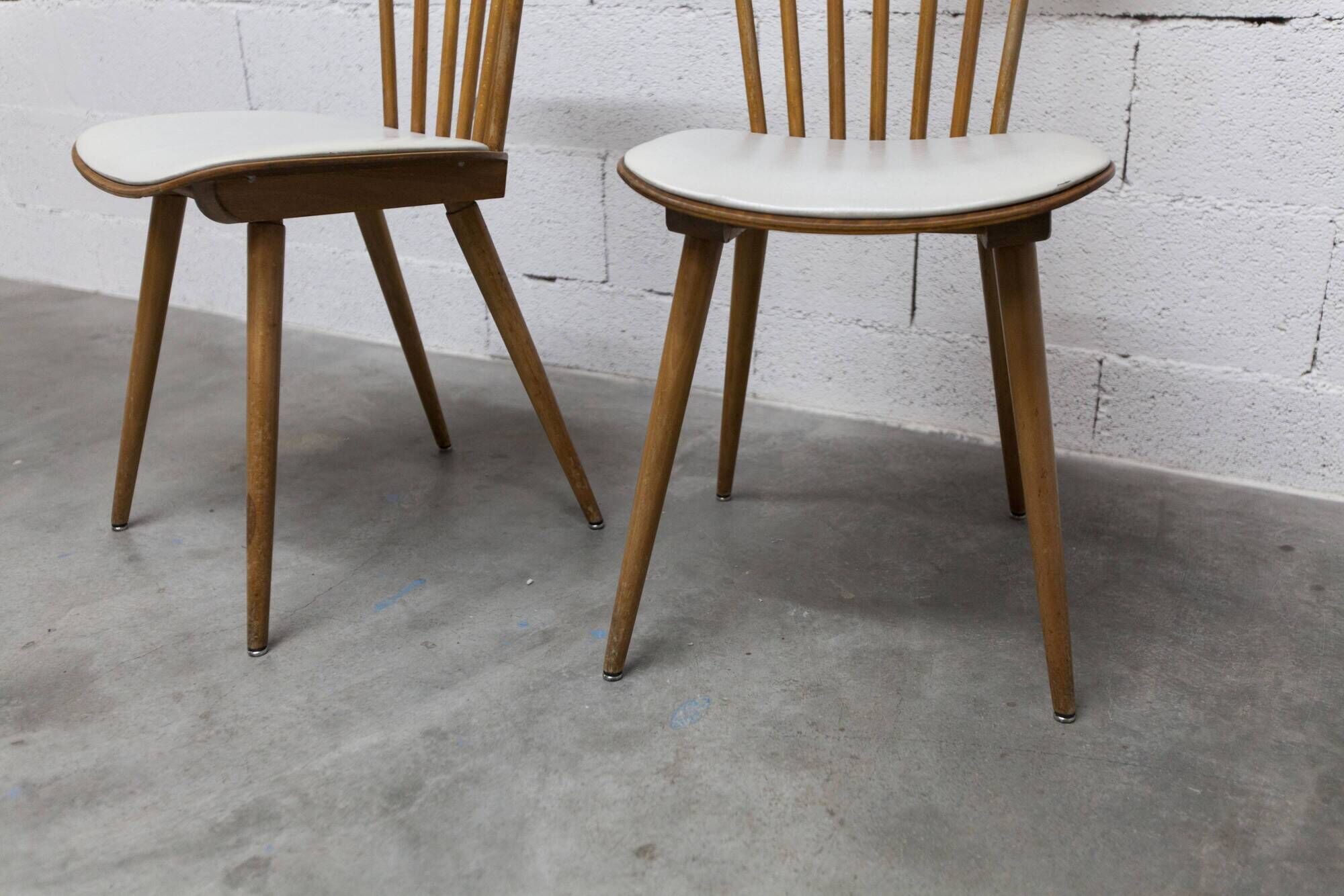Pair of Baumann Menuet chairs, Honey patina, White skai seat