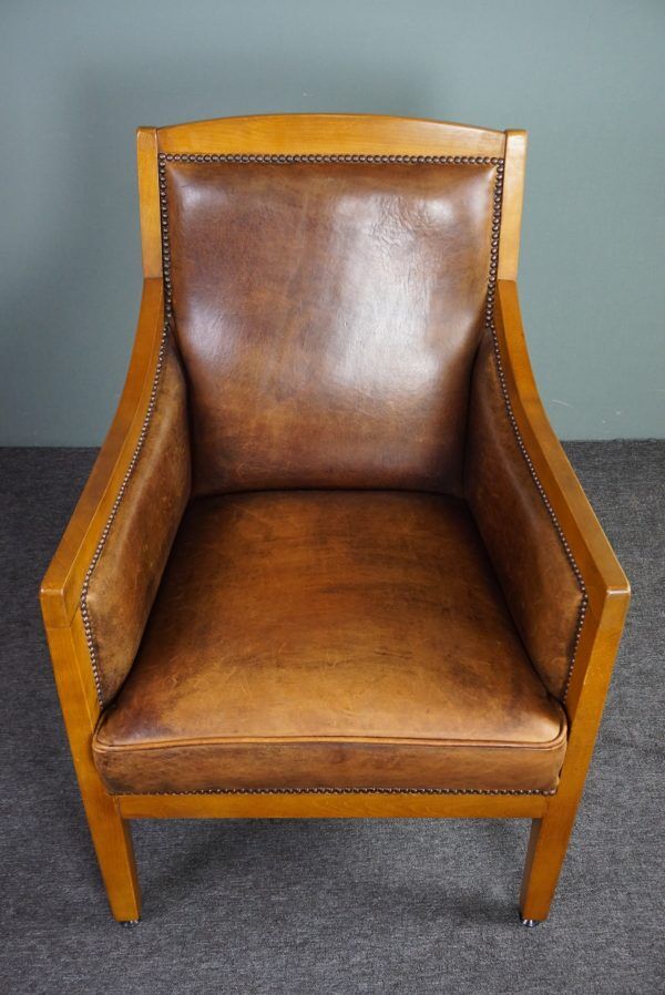 Armchair in sheepskin with beautiful light wood