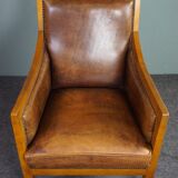 Armchair in sheepskin with beautiful light wood