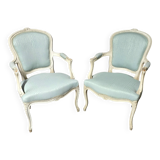 Pair of Louis XV style armchairs in patinated wood, light blue fabric.