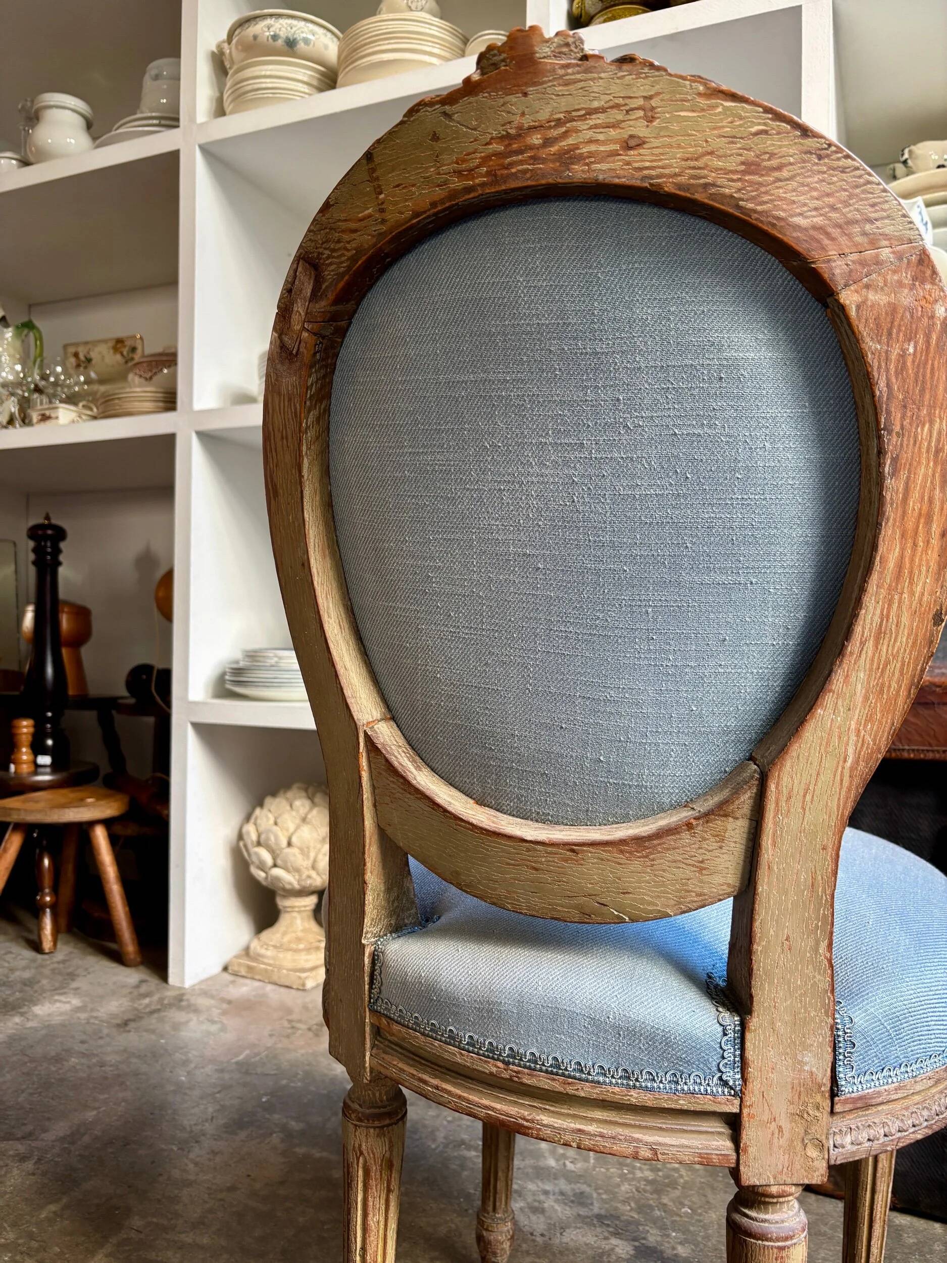 Medallion back chair in reclaimed wood and blue cotton.