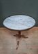 Gueridon dessu marble