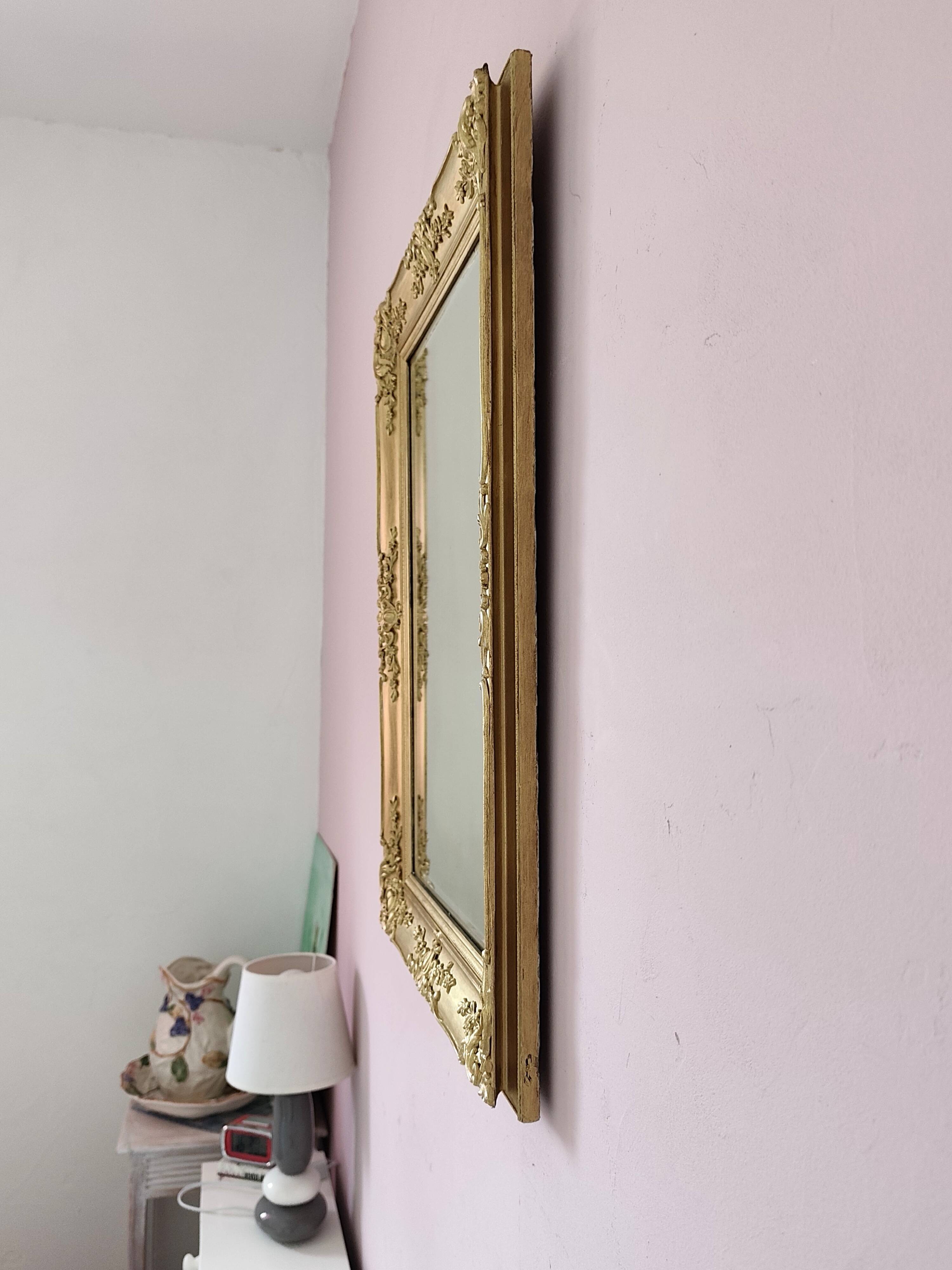 Richly carved antique gilded mirror