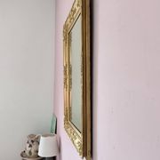 Miroir ancien doré richement sculpté