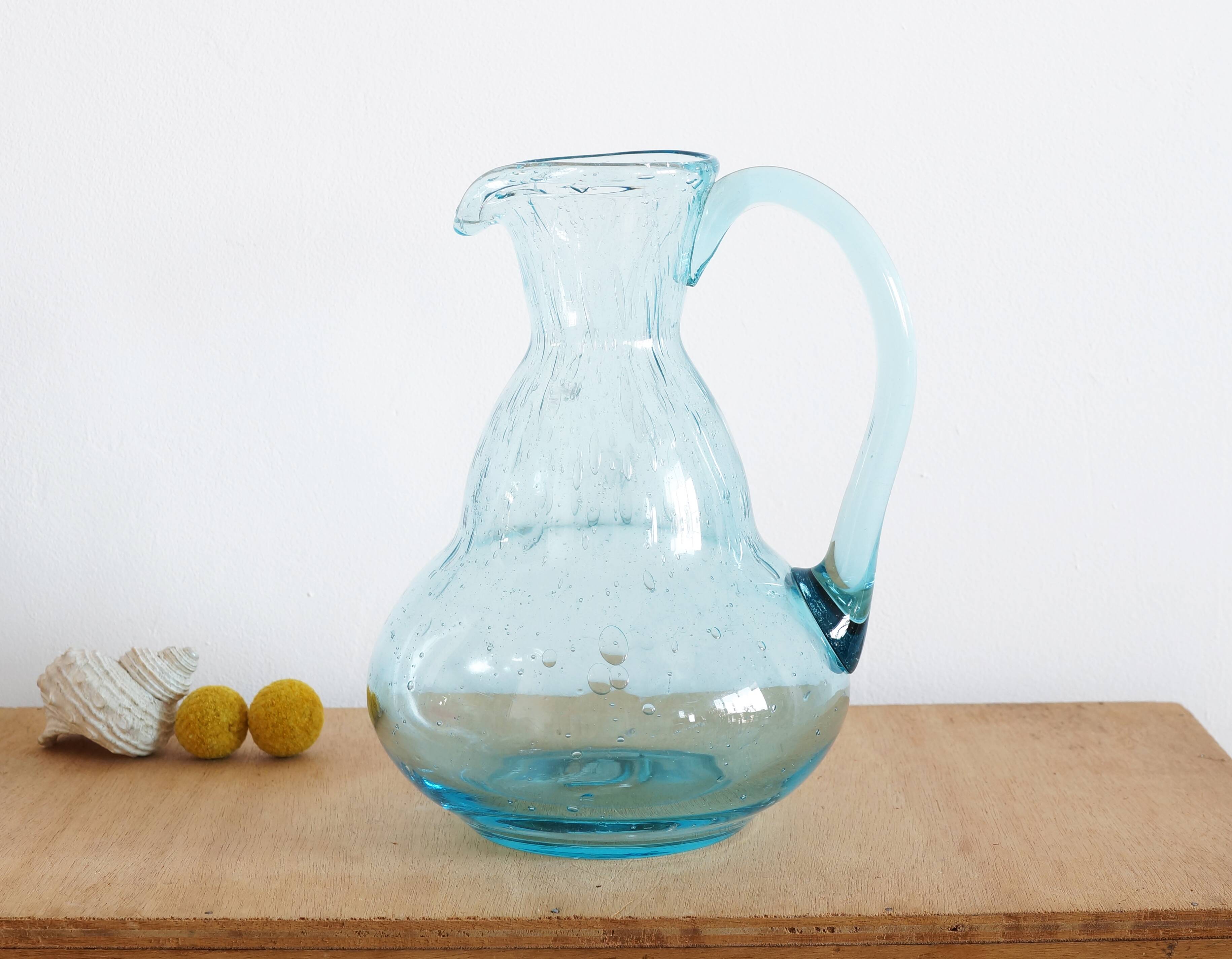 Blue carafe in bubble blown glass