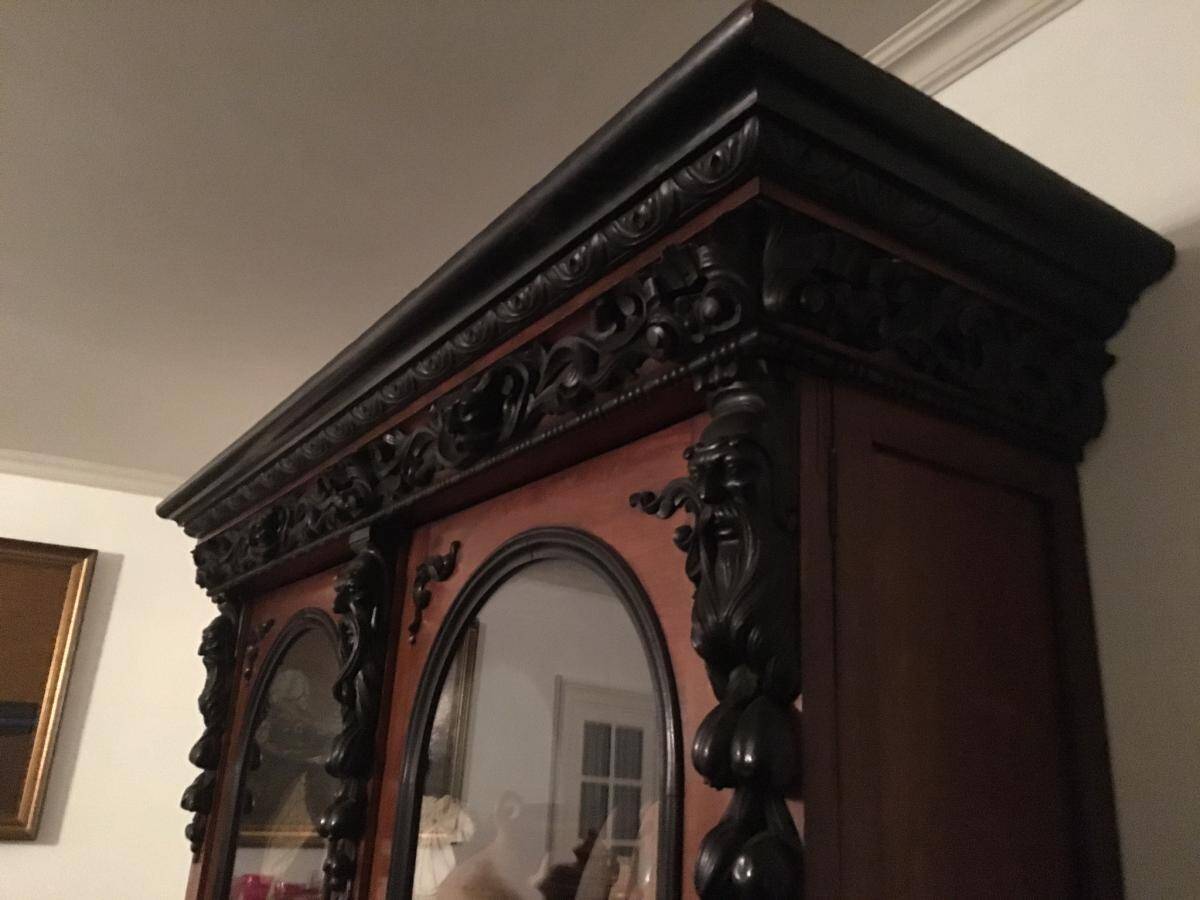 Large display cabinet in walnut veneer and blackened wood, 19th century.