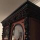 Large display cabinet in walnut veneer and blackened wood, 19th century.