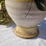 Handcrafted jug or jar with a handle, terracotta pottery vase, fat lava effect, stylized flowers