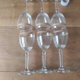 Set of 6 glasses with gold band decorations.