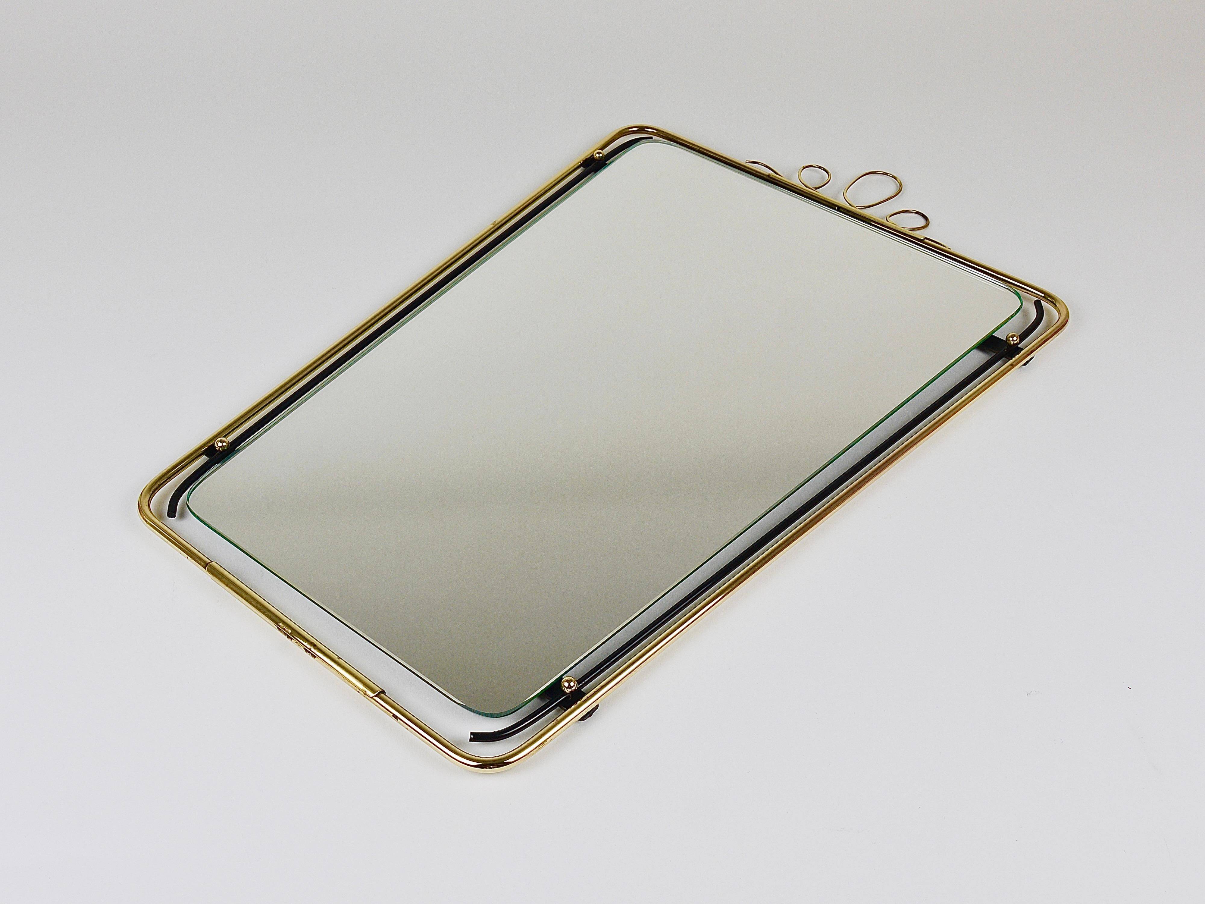 Wall mirror in brass wire with modernist loops from the mid-century, Italy, 1950s.