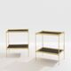 Pair of neoclassical side tables in brass and black leather by Maison Jansen, 1960.
