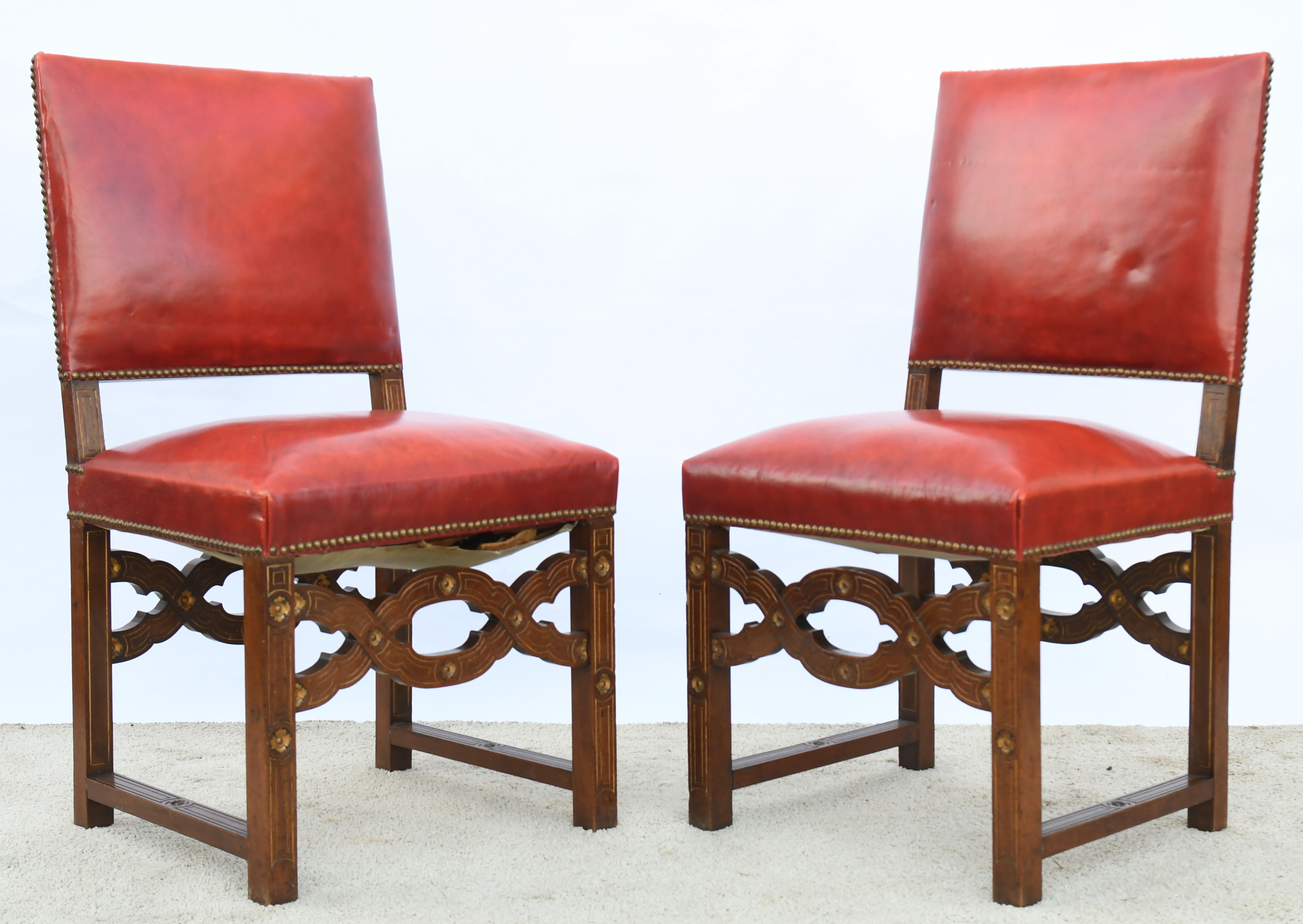 6 red leather chairs