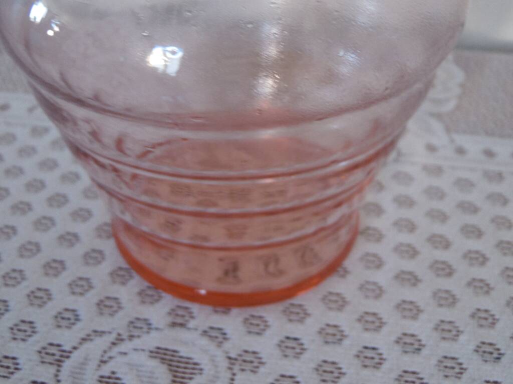 Pink transparent glass carafe with bubble cap