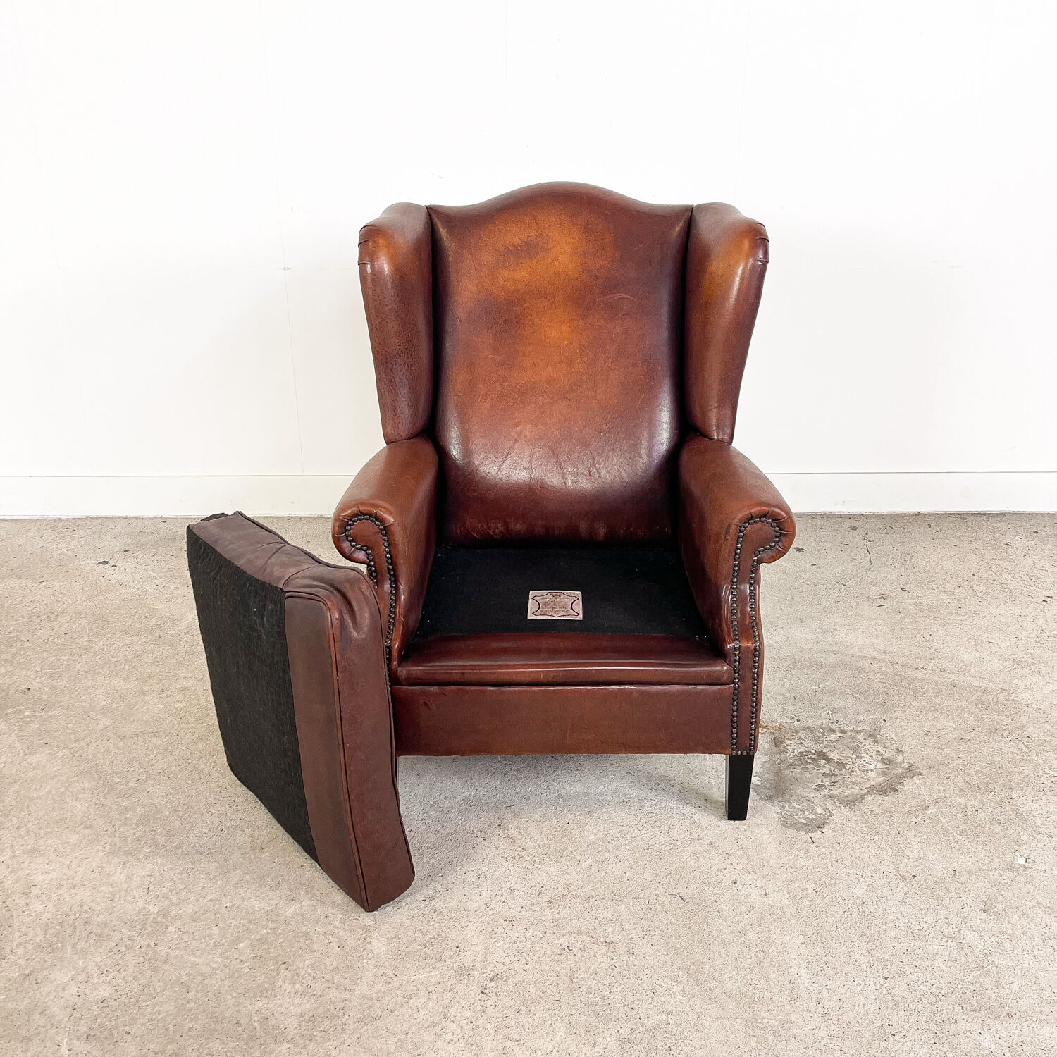 Vintage sheep leather wingback armchair, Druten