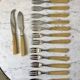 Set of 12 forks and 2 dessert serving knives in horn 60s