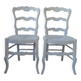 Duo of country-style chairs re-enchanted in pearl gray.