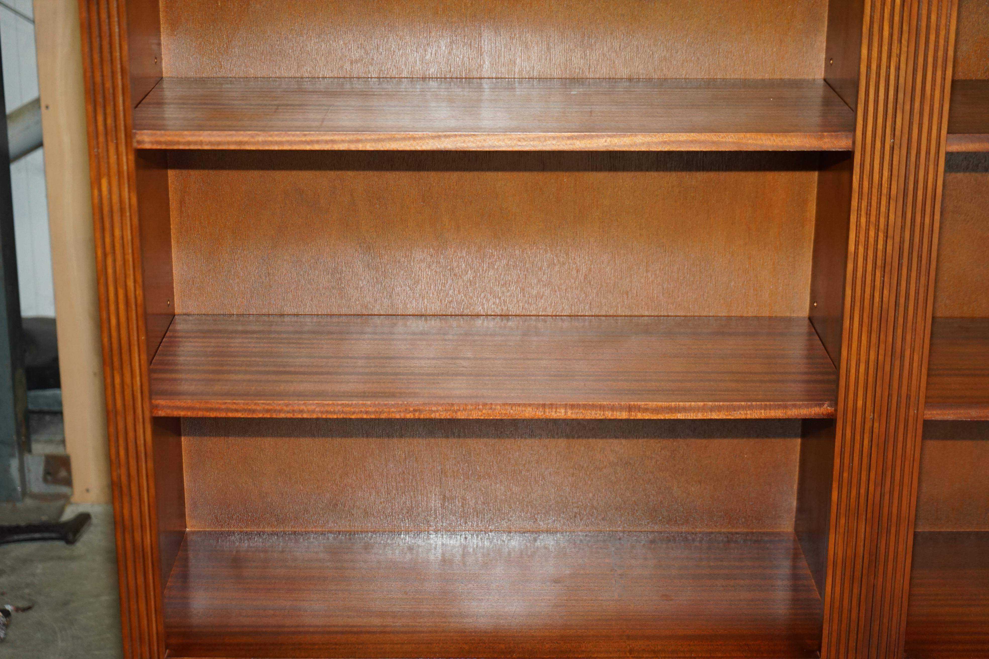 Corner library made of flamed hardwood, in 3 parts.