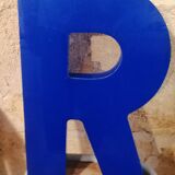 Letter R vintage sign in blue plexiglass