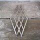 Modernist design foldable trivet in silver metal Jacques Adnet 1940/1950