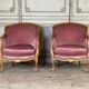 Pair of Louis XV style bergère armchairs in carved wood, pink velvet, circa 1900