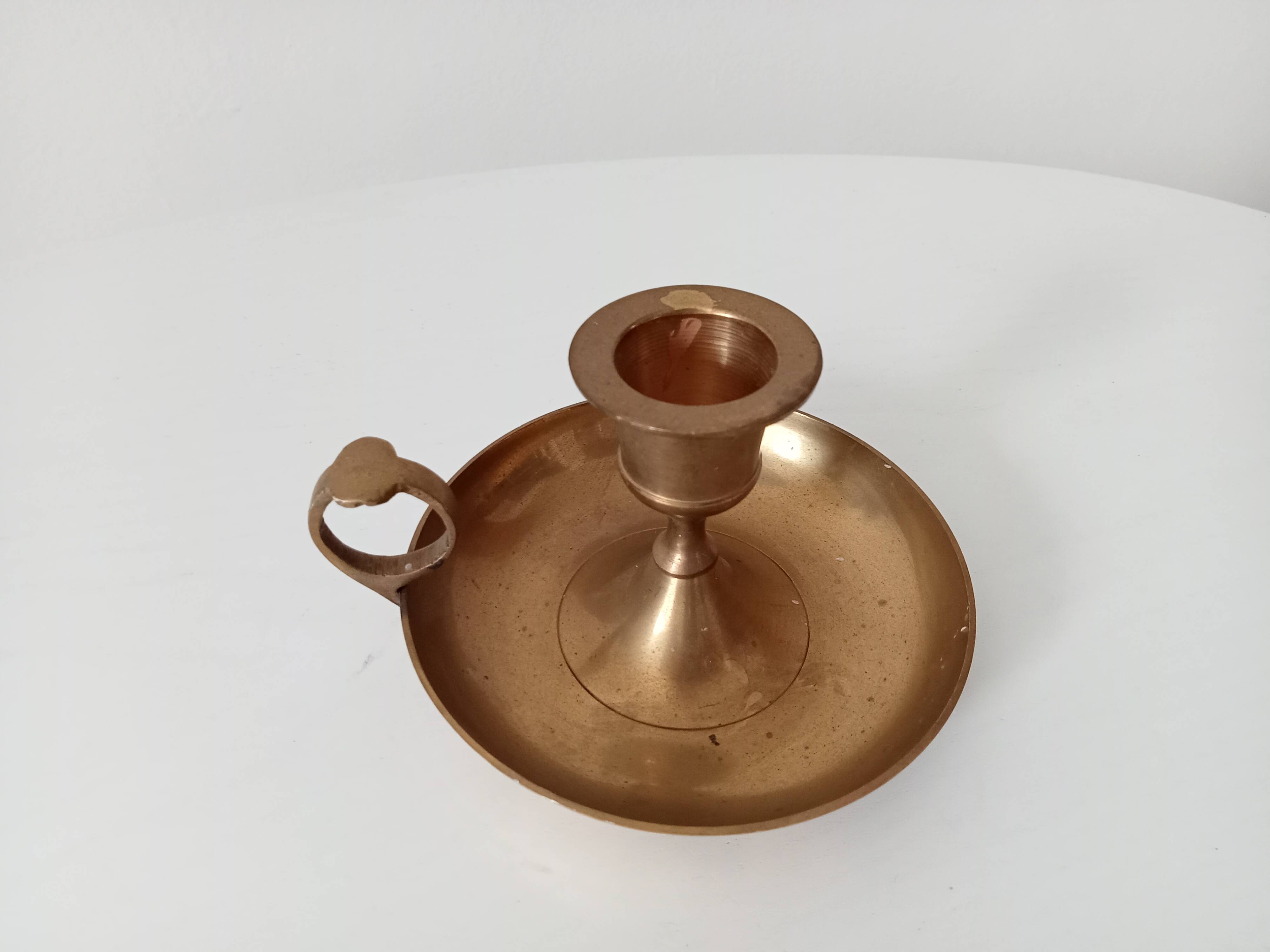 Vintage golden brass hand candle holder