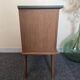 Renovated vintage bedside table in wood, with tapered legs – Matt green & gold background