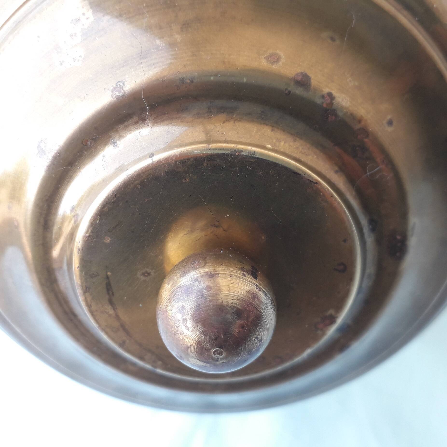 Glass and brass suspension