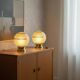 Pair of large art deco globe table lamps with brass legs