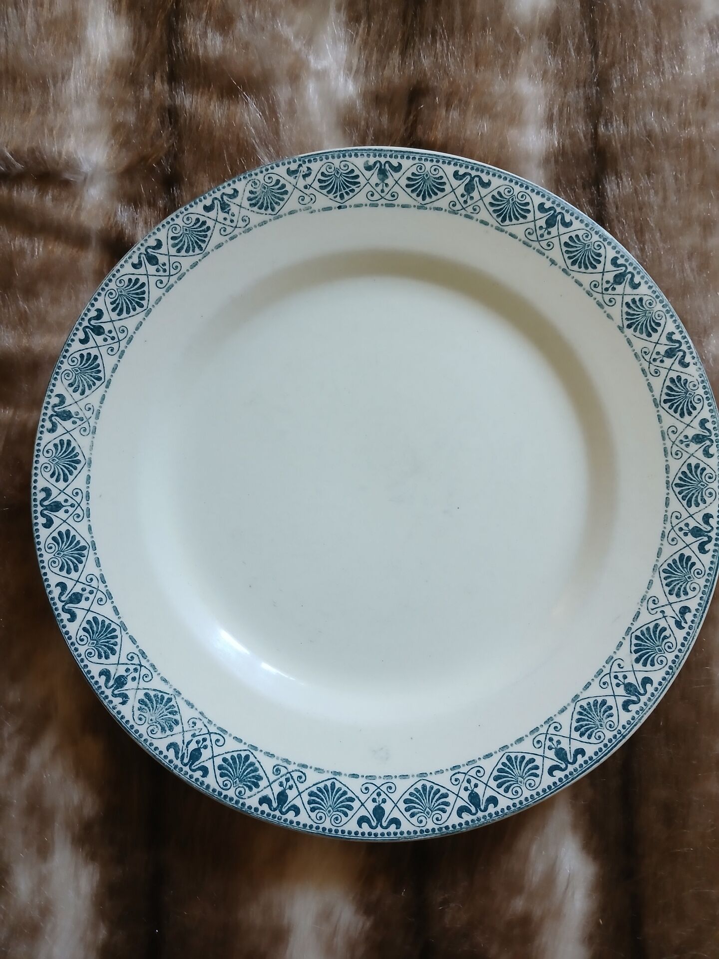 13 mismatched flat plates in ironstone