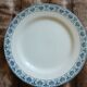 13 mismatched flat plates in ironstone