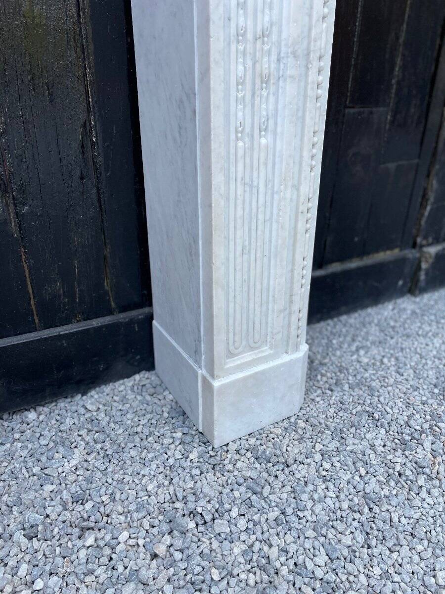 Louis XVI fireplace in Carrara marble