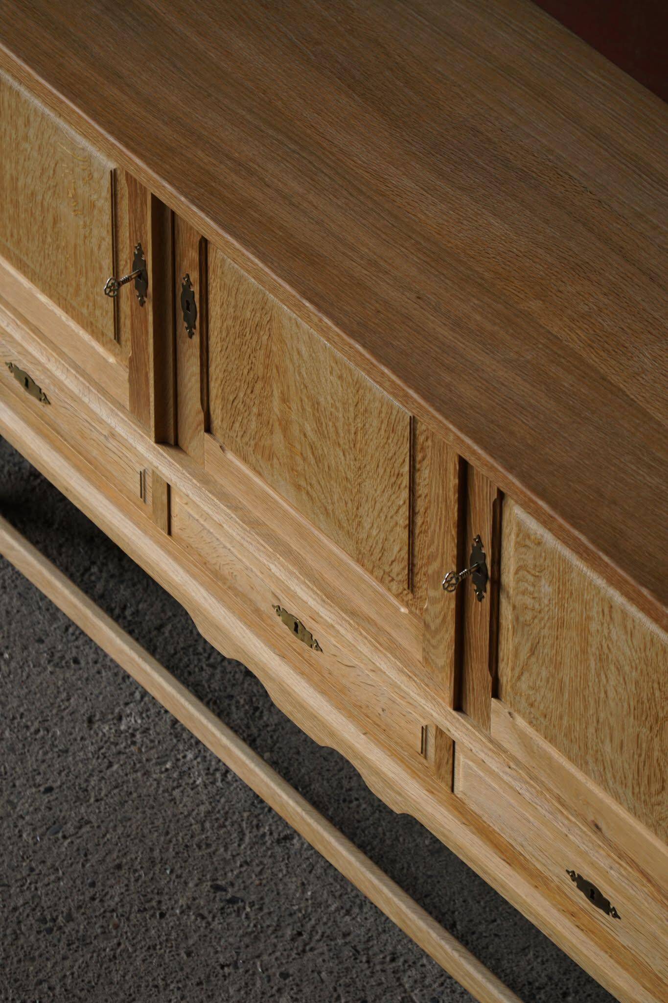 Brutalist Danish enfilade from the mid-century in oak by Henning Kjærnulf, 1960s.