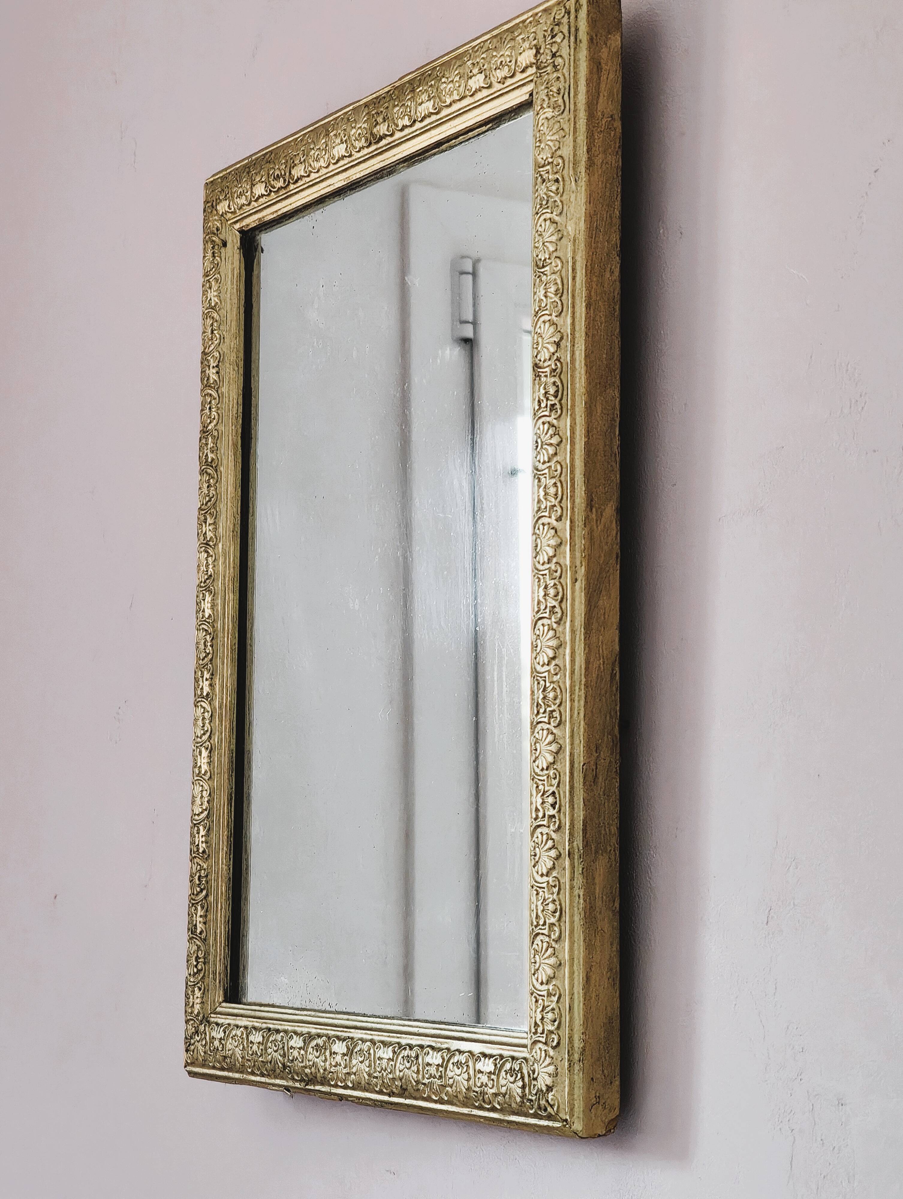 Rectangular wooden mirror with ornate Art Nouveau gold finish.