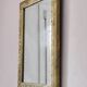 Rectangular wooden mirror with ornate Art Nouveau gold finish.