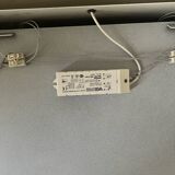 Modernist wall lamp with white metal shade, design by C. Grandidier.