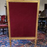 Golden wooden bergère in Louis XVI style upholstered in Bordeaux velvet.