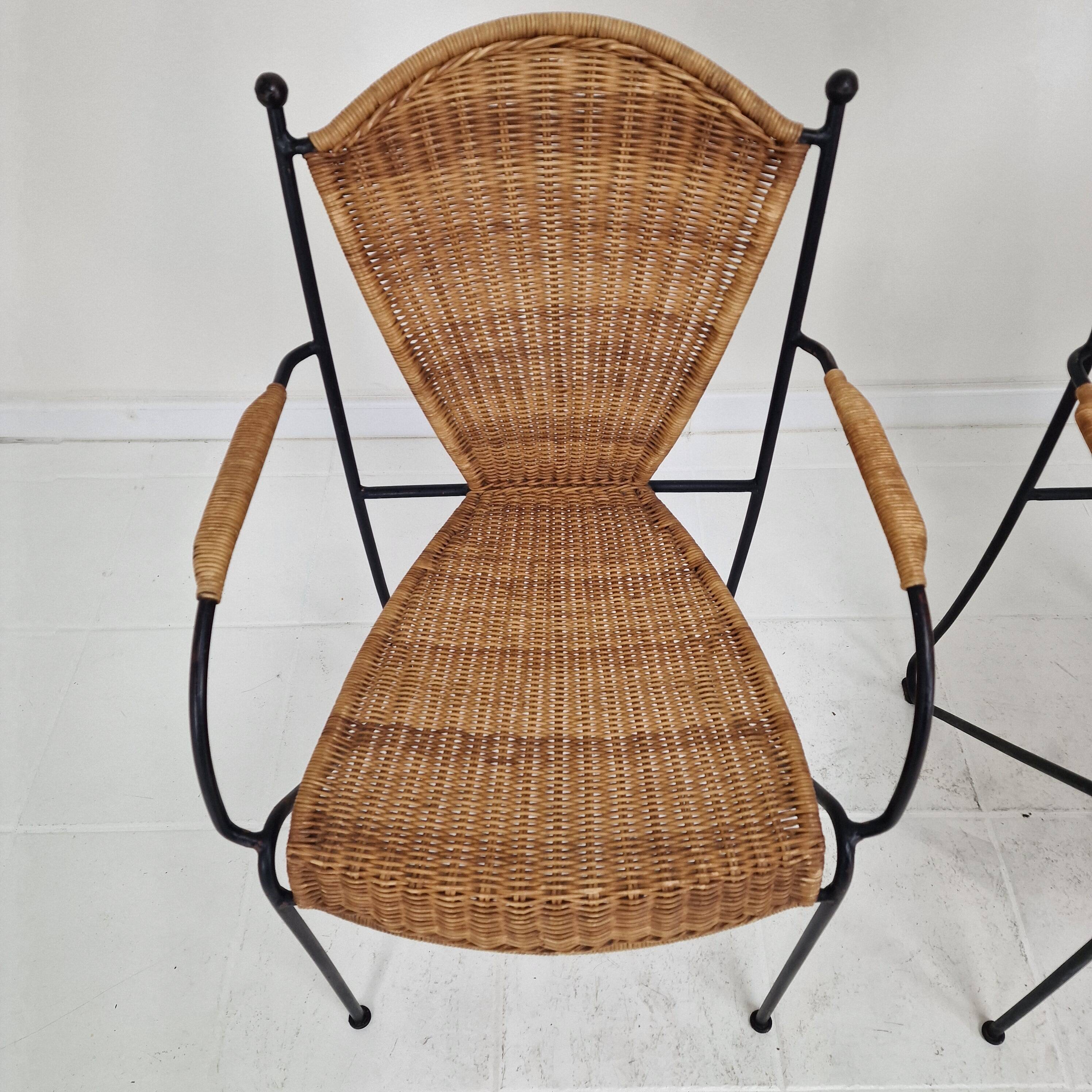 Pair of wicker and iron armchairs by Frederic Weinberg, United States, 1950s.