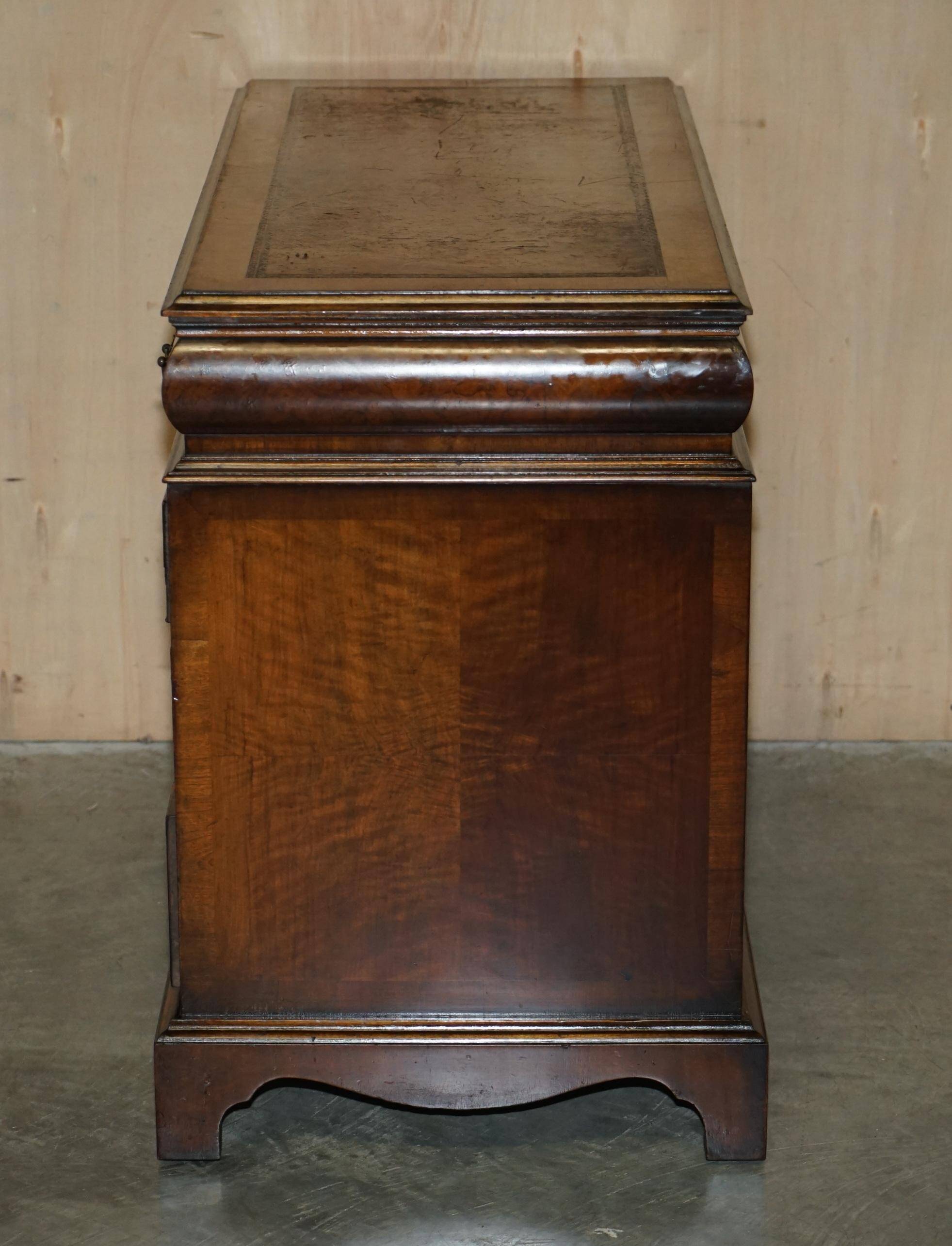 Victorian antique partner's desk in veined walnut with a leather top.