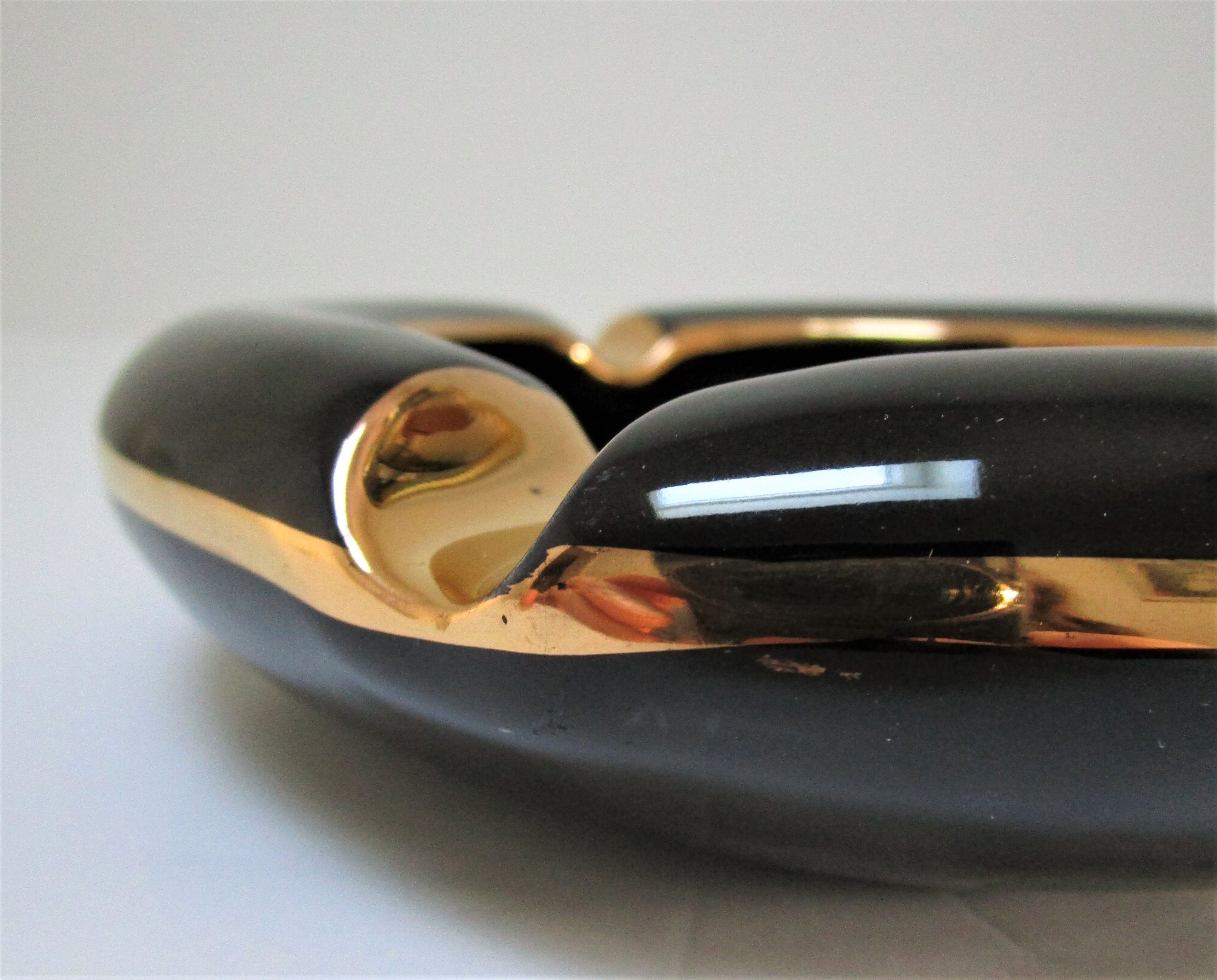 Black ceramic ashtray and vintage gold 50/60
