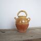 Old gargoulette pot in glazed terracotta
