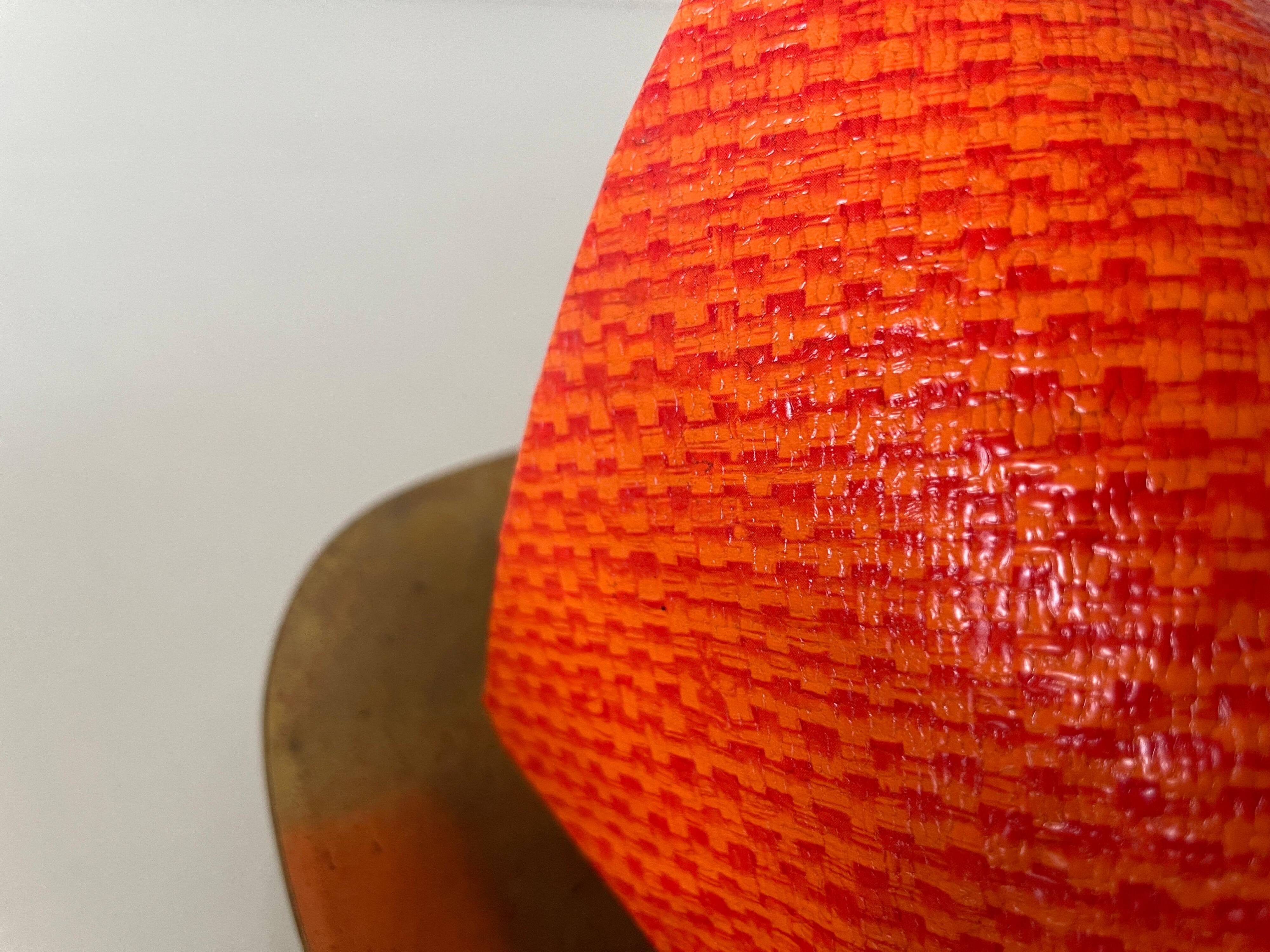 Pair of orange plexiglass and curved brass wall lights, 1950s, Germany