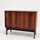 Low sideboard in rosewood with sliding doors. Denmark, 1960s