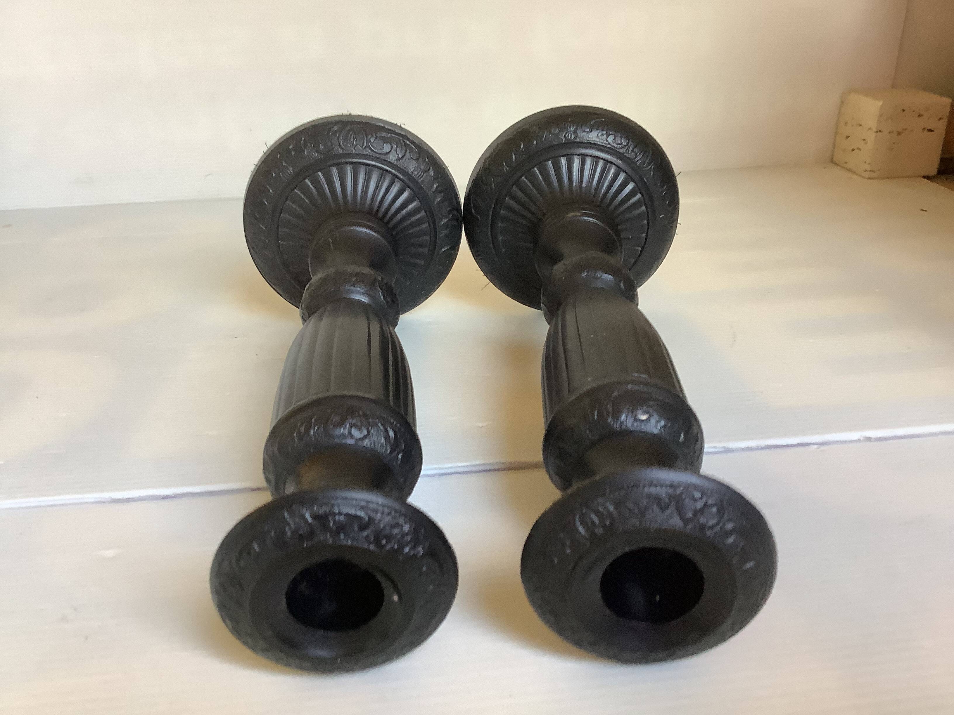 Pair of large black metal candlesticks