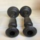 Pair of large black metal candlesticks