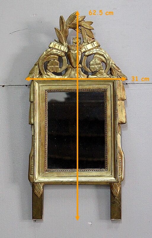 Miroir en bois doré, style Louis XVl, début XXe