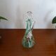 Old carafe enamelled with glass flowers
